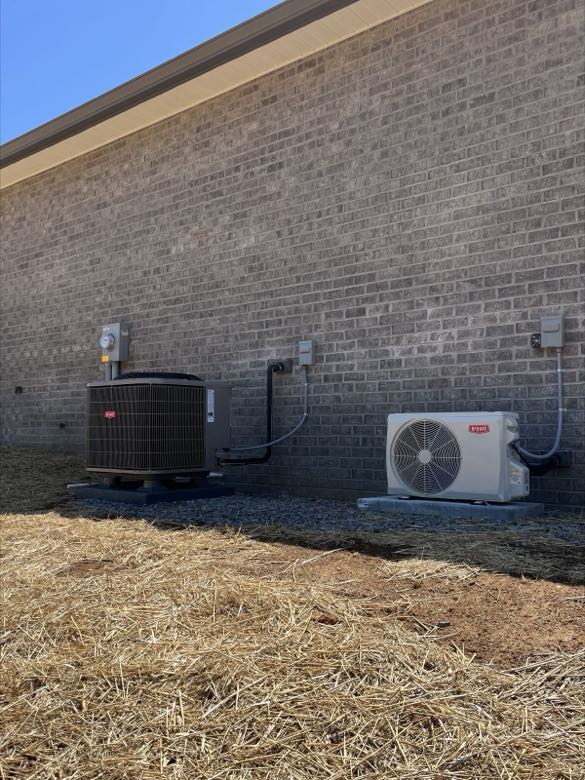 Condenser and mini-split units installed side by side